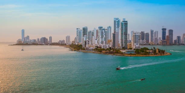 Modern skyscrapers along the coastline of Bocagrande district, close to the harbor of Cartagena, Colombia, South-America. Colorful image of the skyline at sunset.